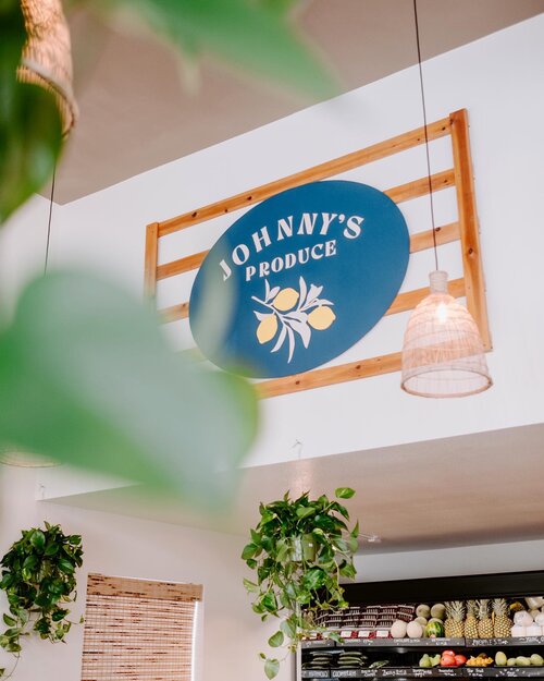 Johnny's Produce logo sign