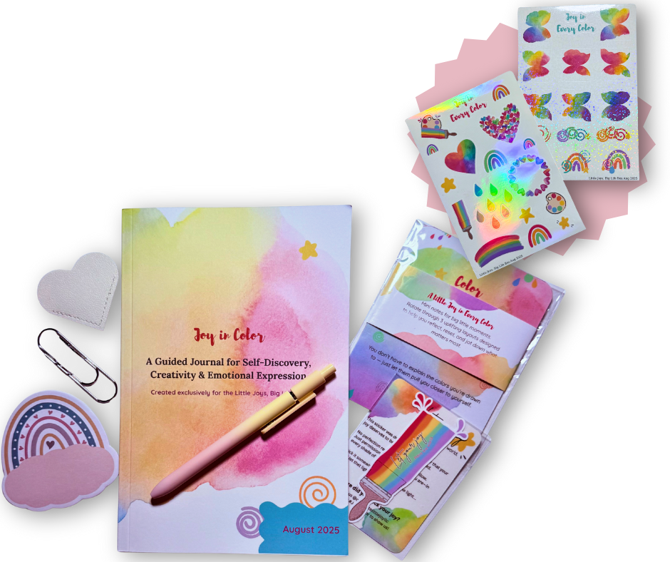 Joy in Color guided journal kit with gradient pen, holographic rainbow stickers, and colorful creative accessories on black background