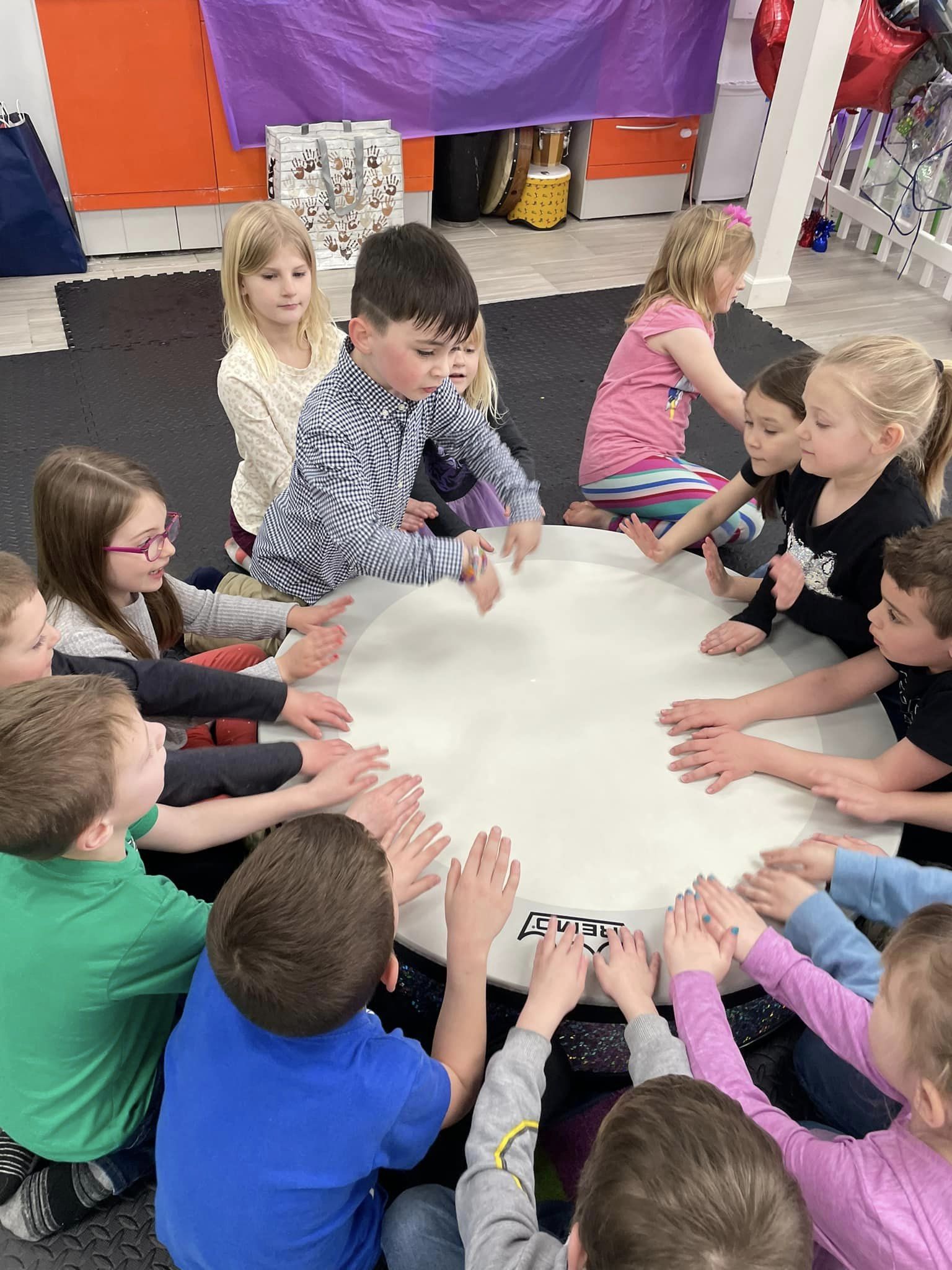 Kids and parents enjoying interactive music class at Play Time Studio
