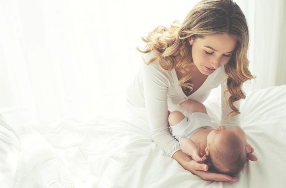 Tender moment of parent holding baby's hand