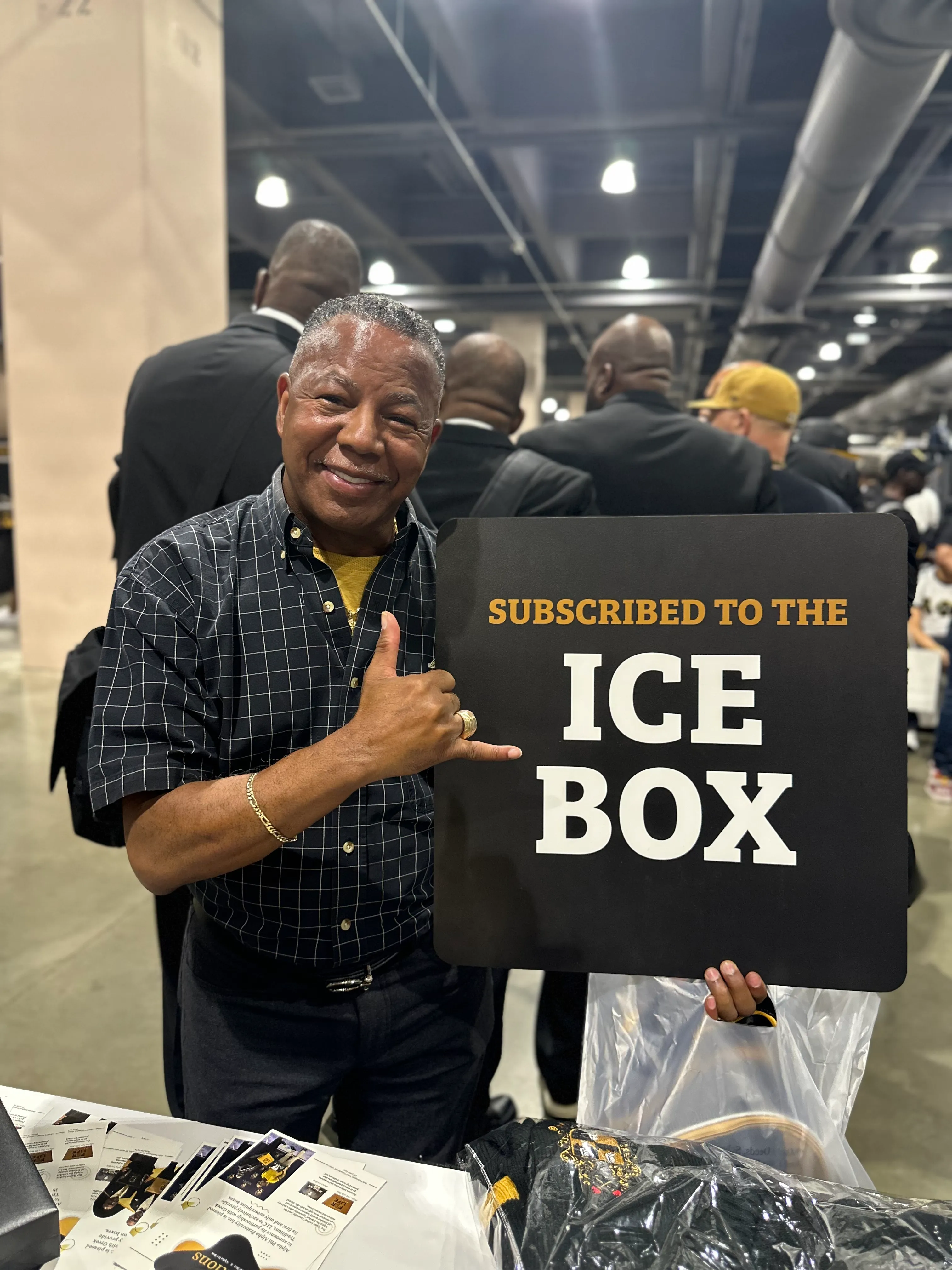 Customer wearing Alpha Traditions fraternity polo at a community service event
