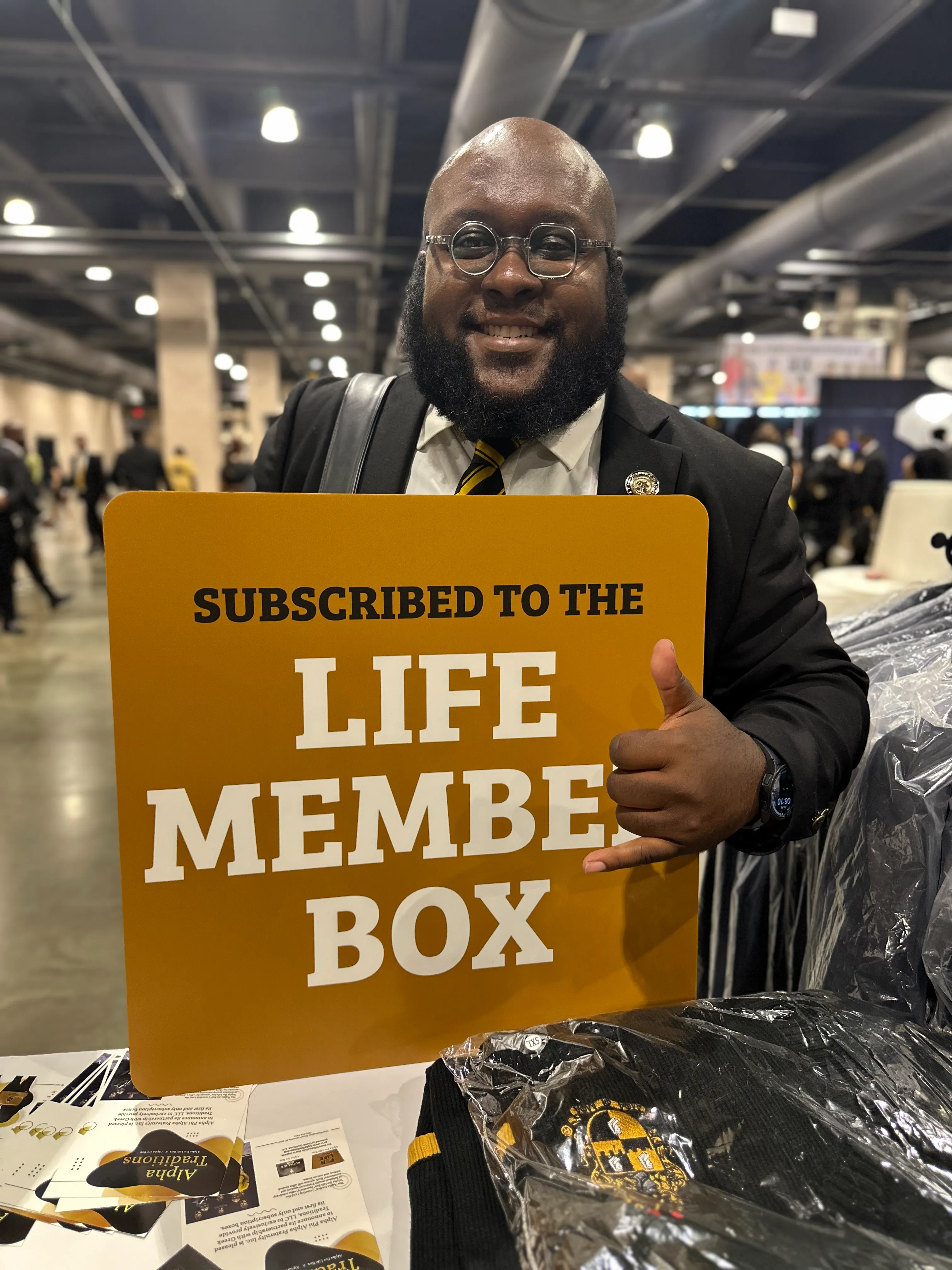 Customer enjoying Alpha Traditions branded merchandise at a fraternity reunion