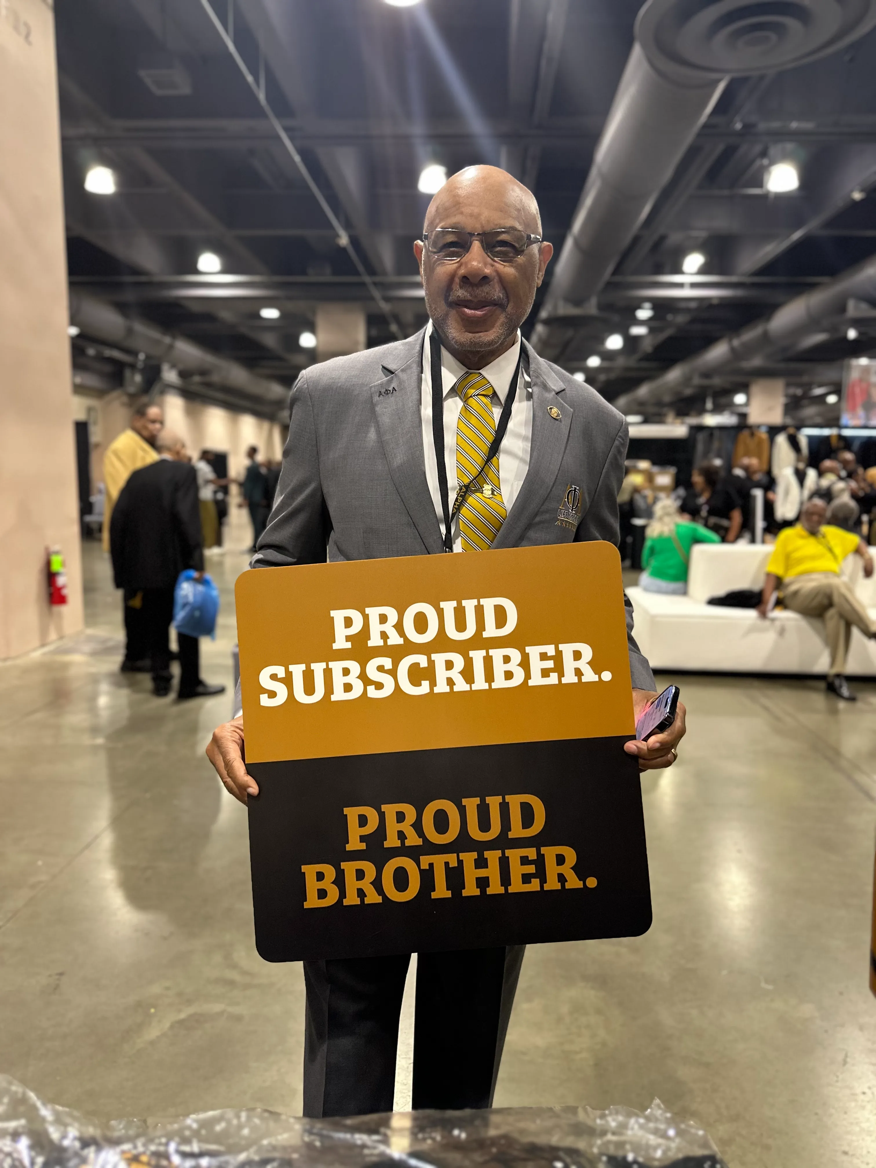 Alpha Traditions member representing brotherhood pride with exclusive branded apparel