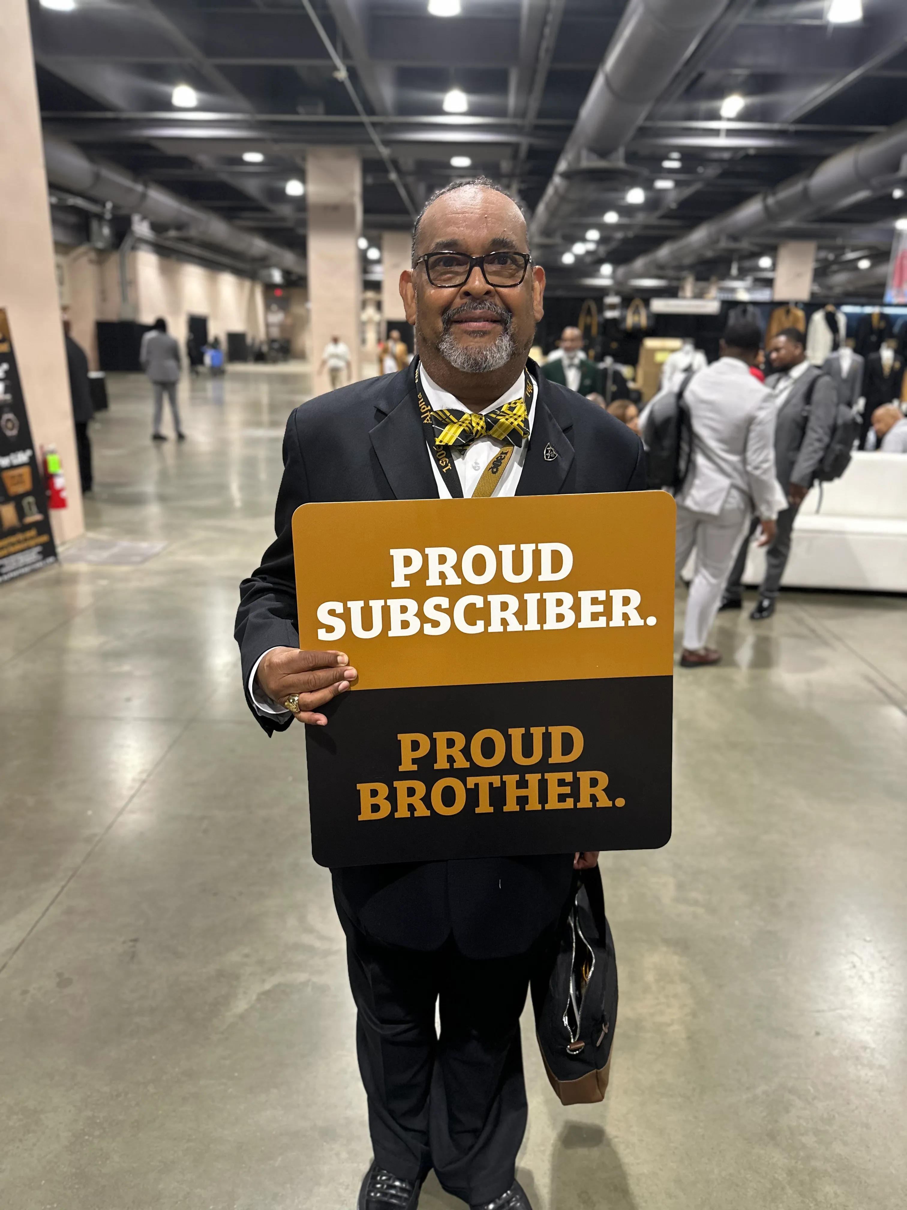 Alpha Phi Alpha brothers sharing a moment of fellowship in Alpha Traditions apparel