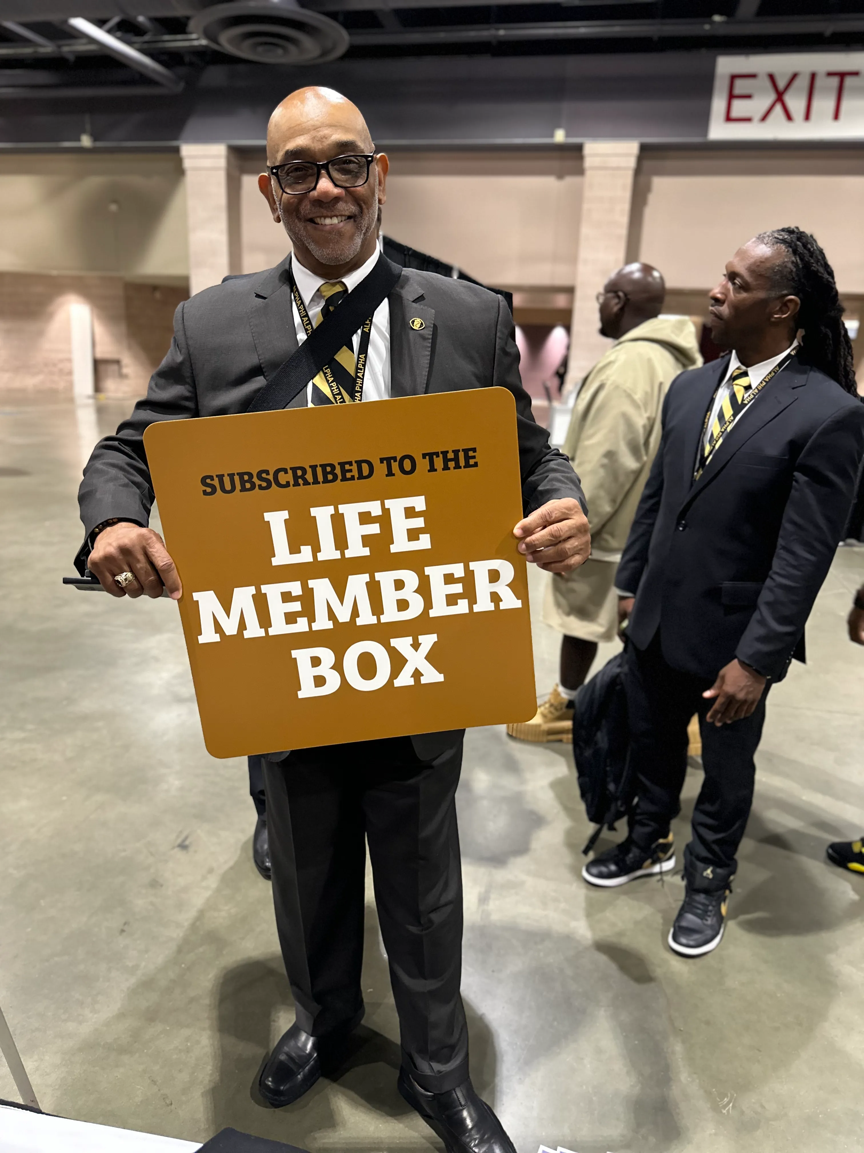 Customer styled in Alpha Traditions exclusive fraternity joggers and tee at a cookout