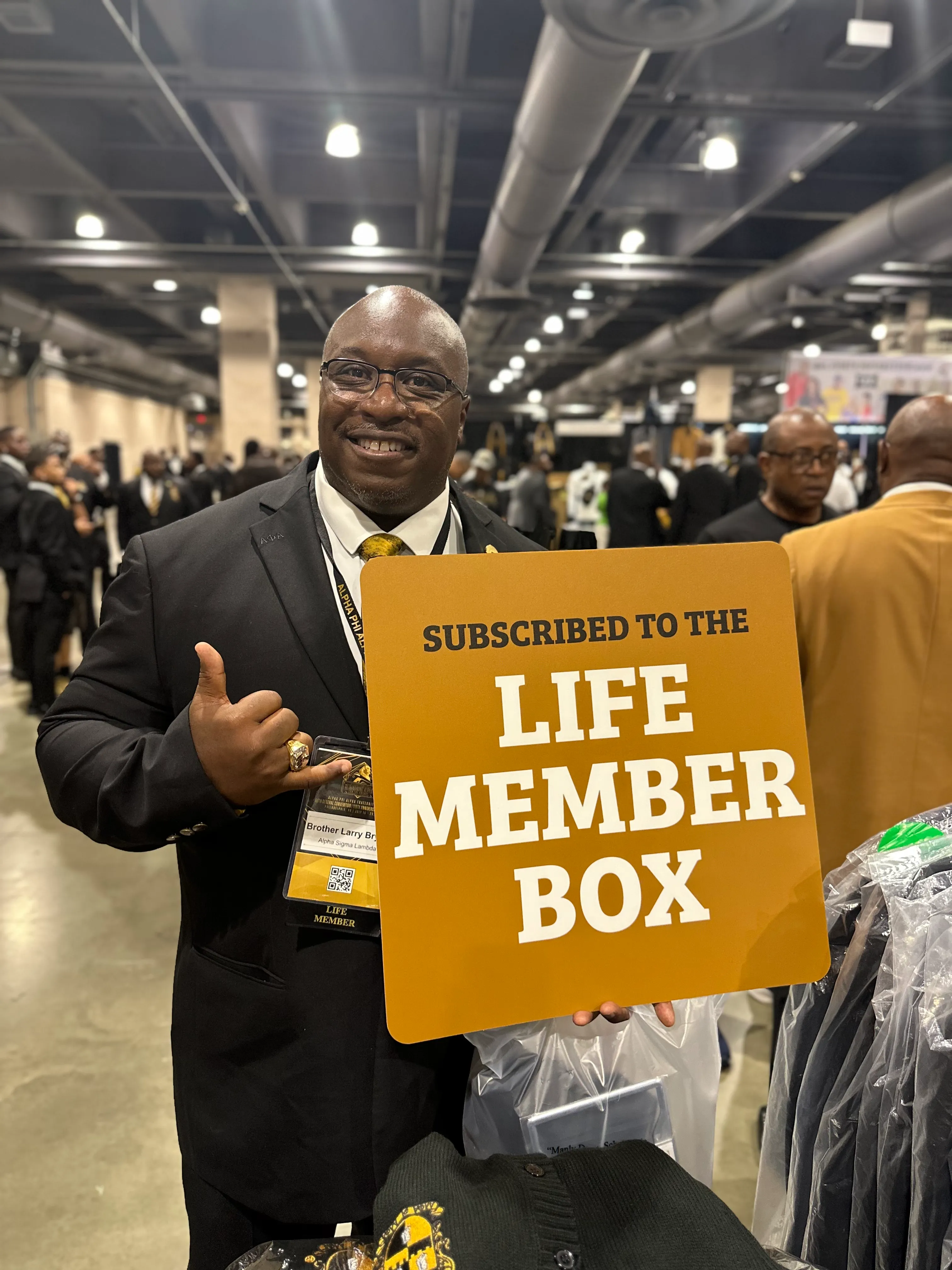 Alpha Phi Alpha brother styled in Alpha Traditions premium subscription box hoodie