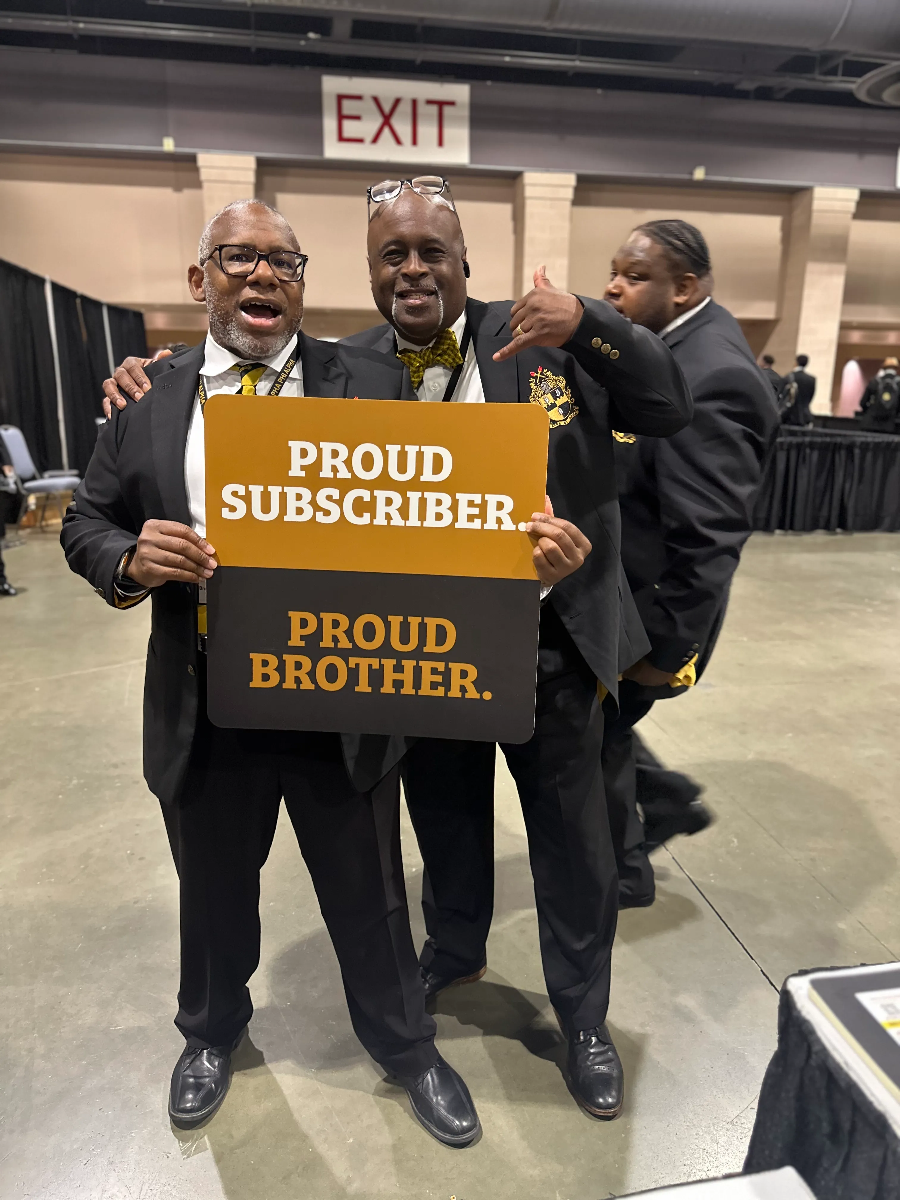 Brotherhood gathering featuring Alpha Phi Alpha members in coordinated Alpha Traditions outfits