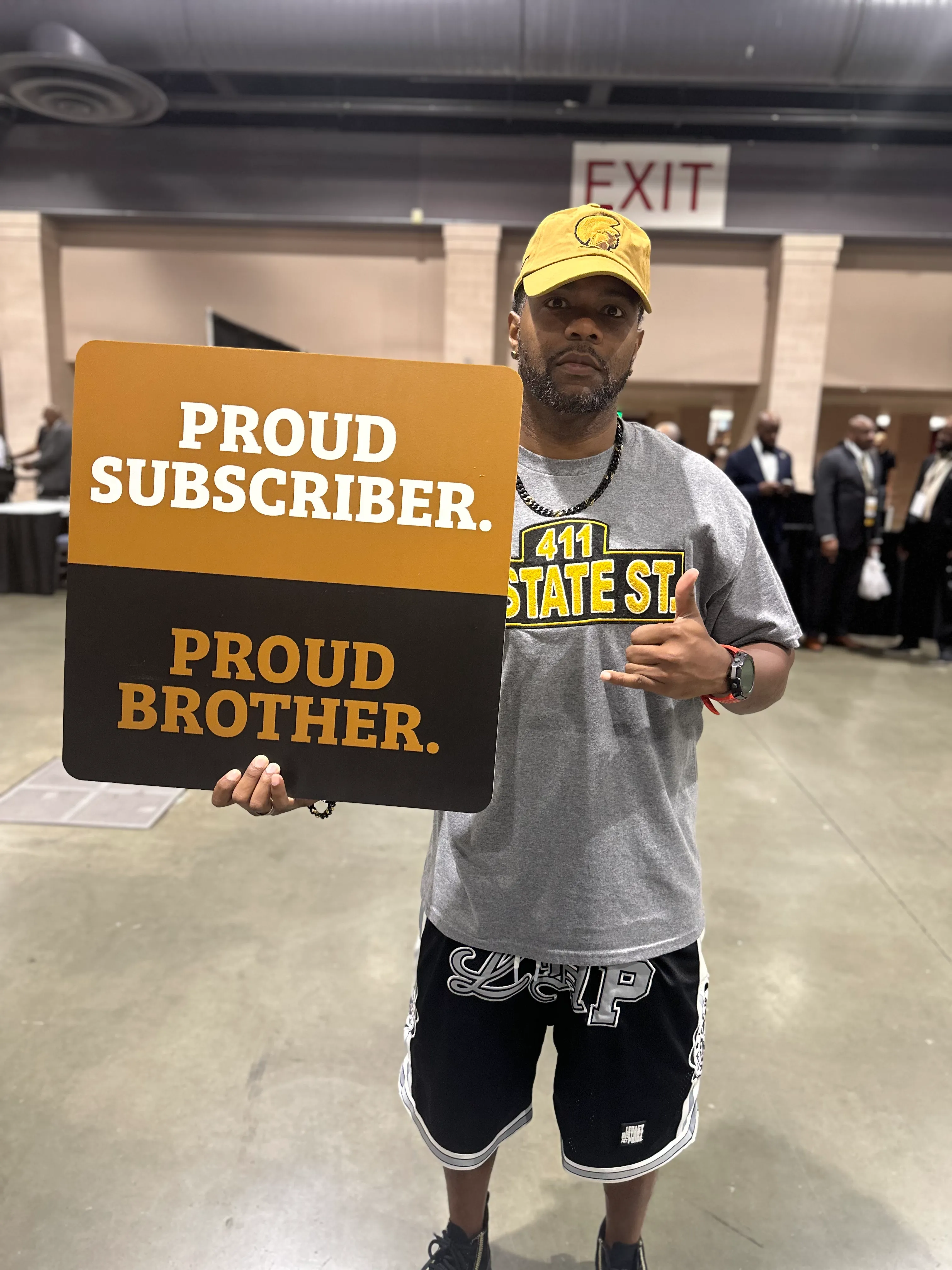 Customer styled in Alpha Traditions exclusive fraternity athleisure at a campus event