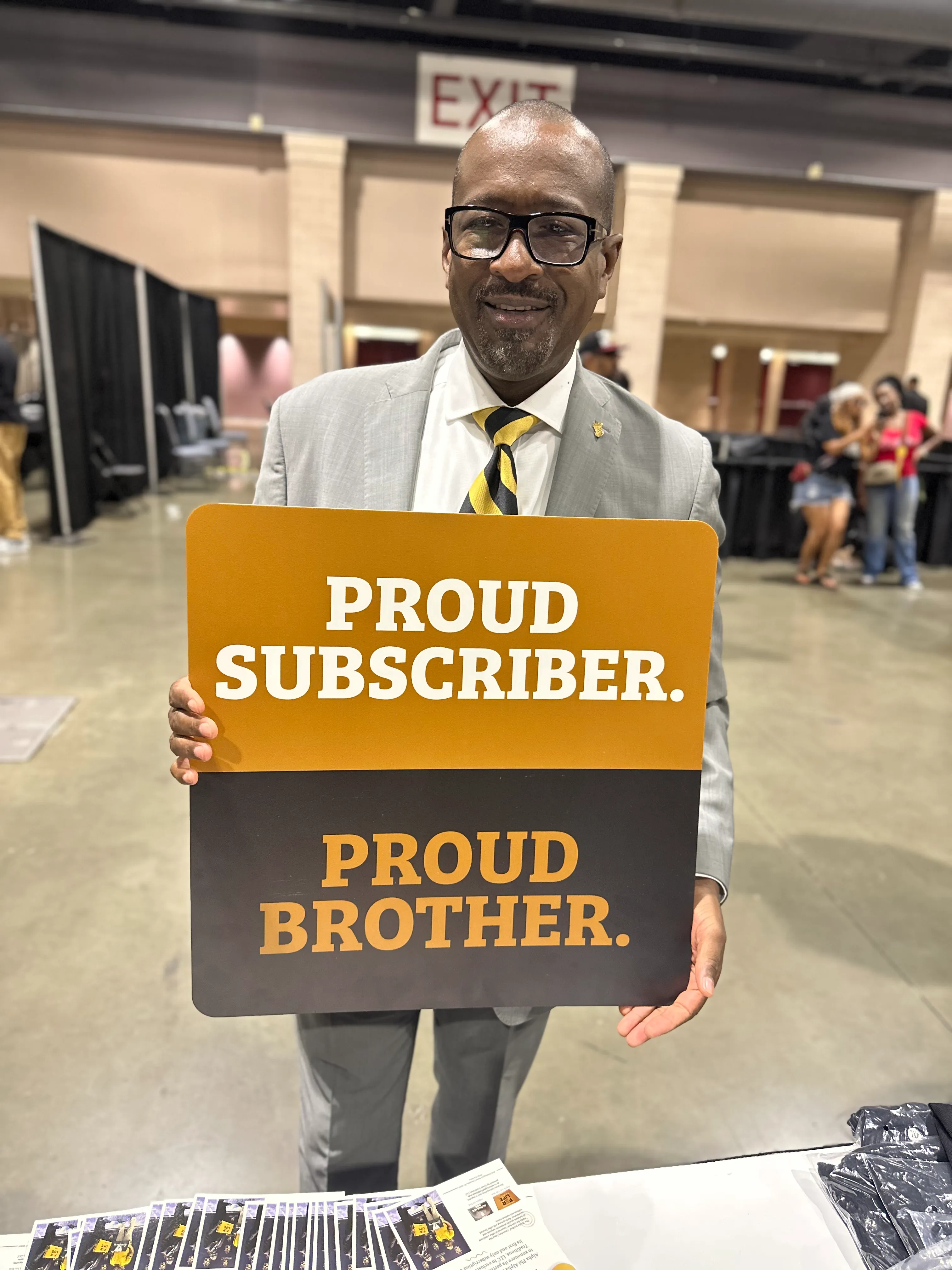 Alpha Traditions community member wearing fraternity branded outerwear at a winter gathering