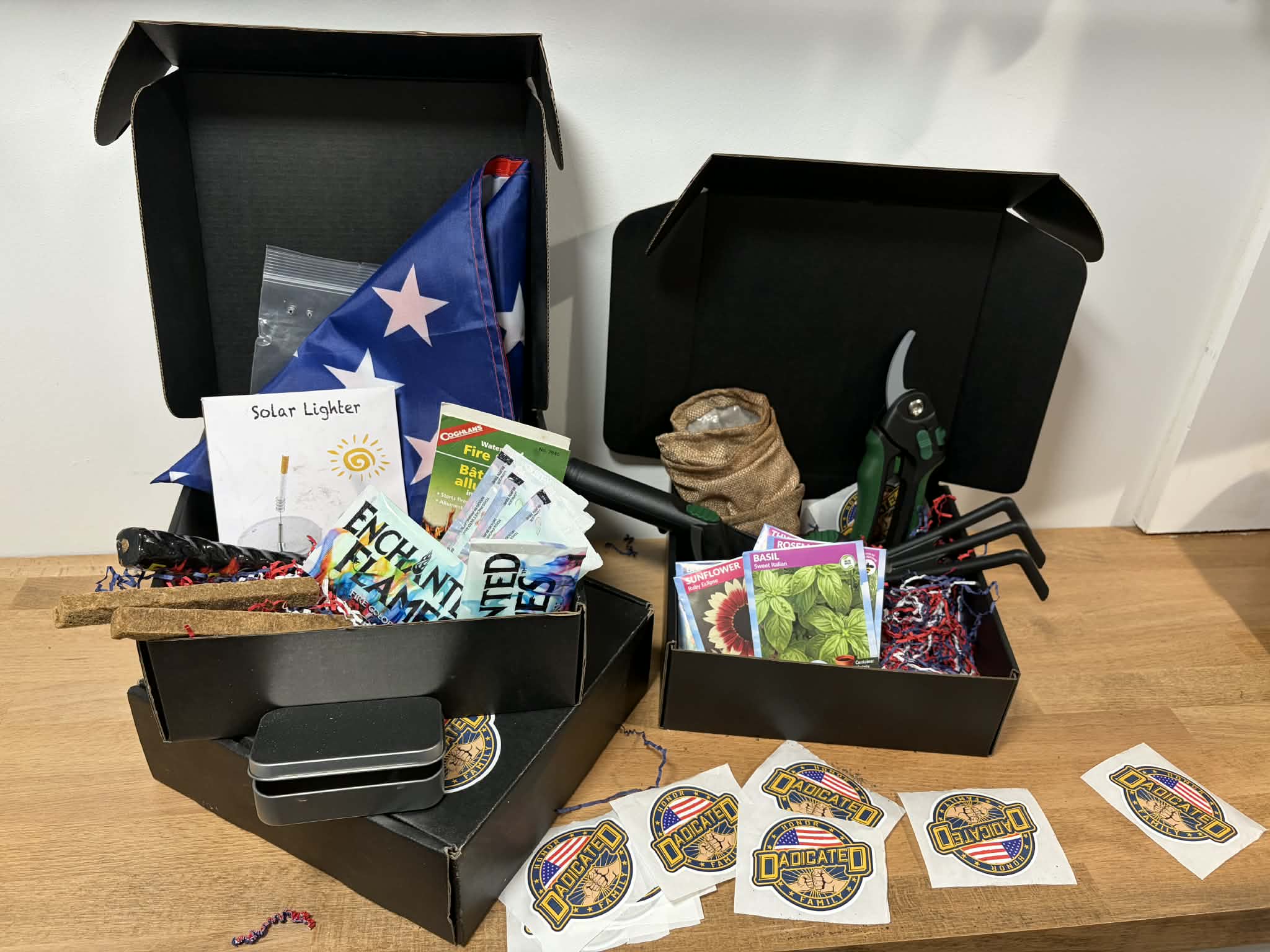 DADicated campfire and gardening boxes with seeds, pruning shears, flag, and fire starters
