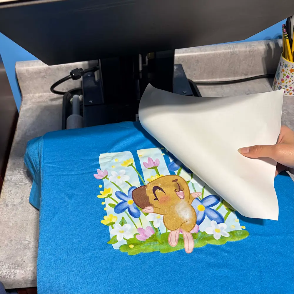 Heat pressing design onto t-shirt