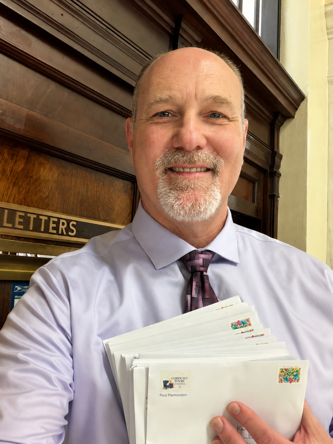 Paul Plamondon at the post office with Curiously Yours letters