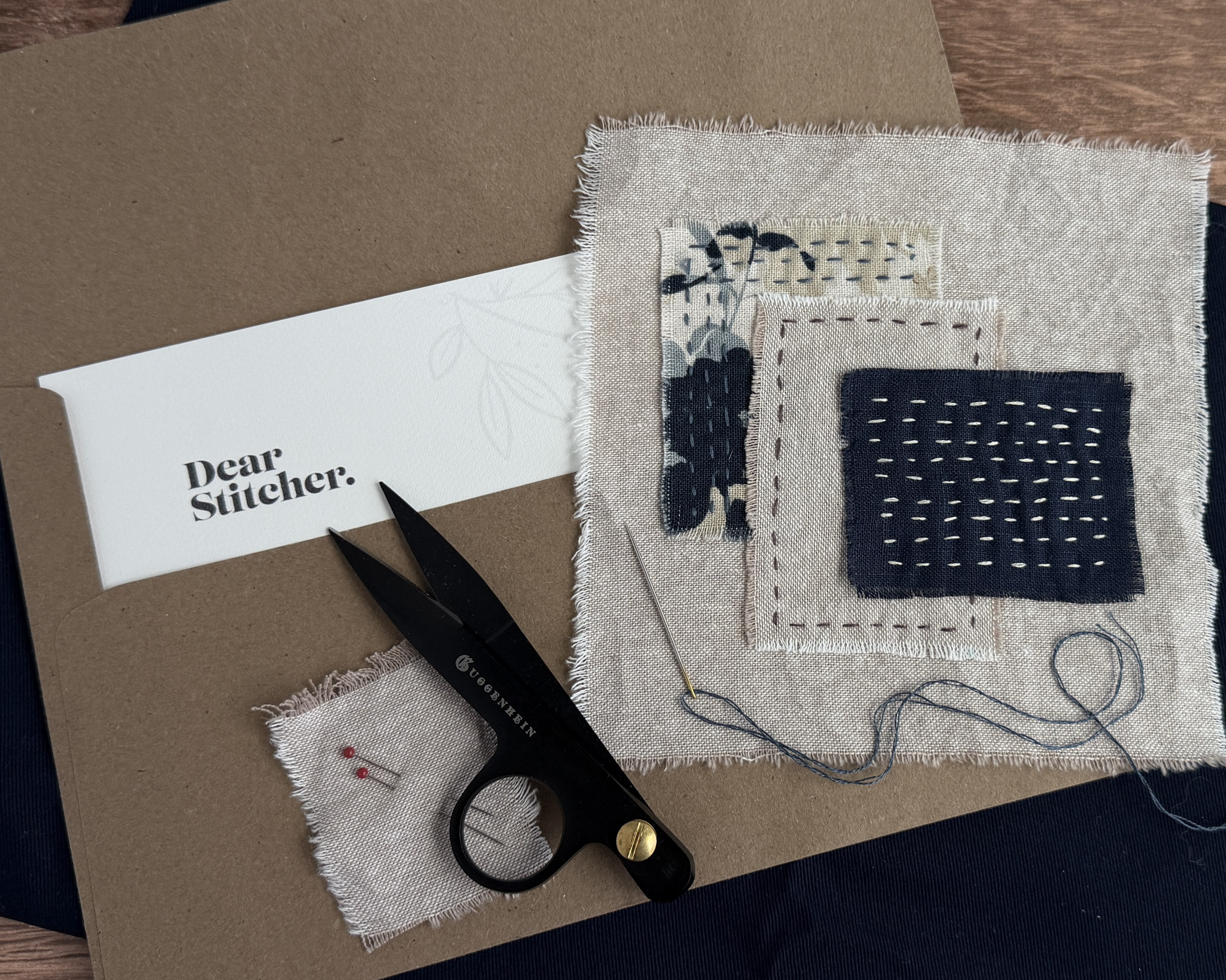 Month 1 finished needlework piece on a brown envelope