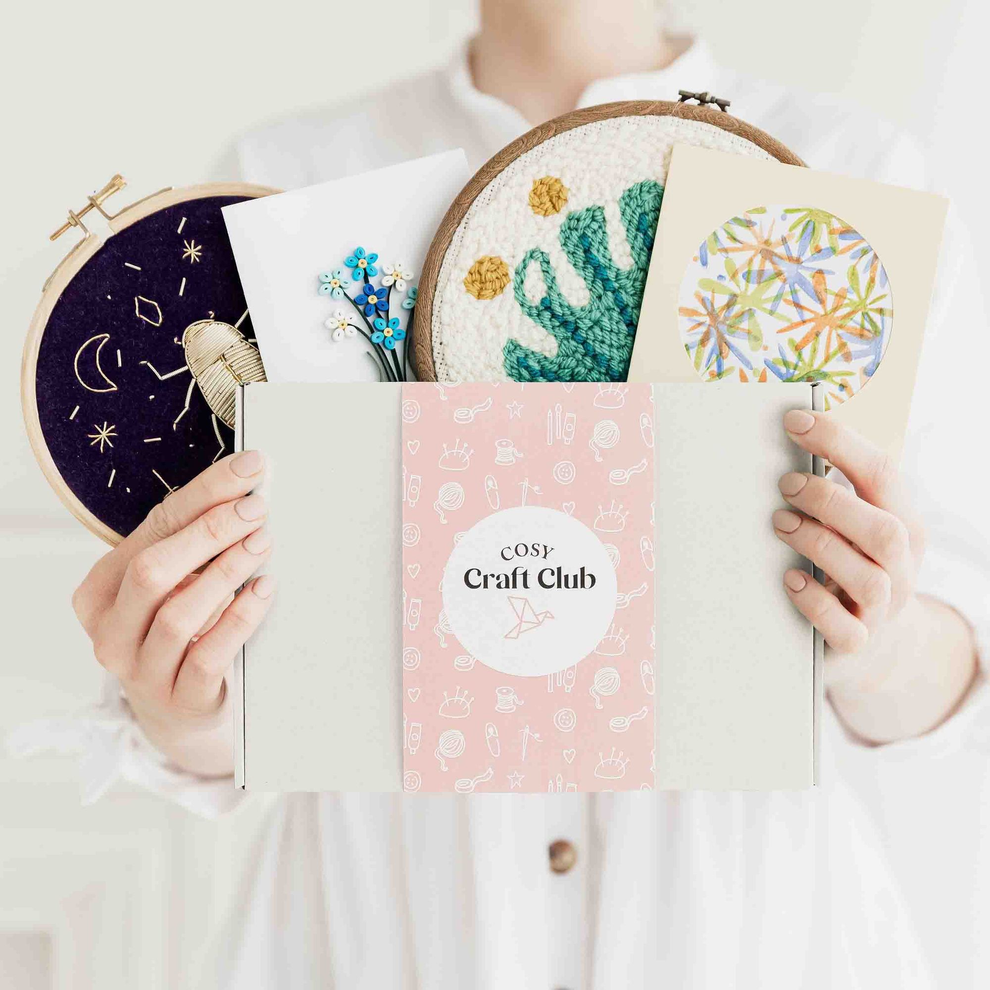 Cosy Craft Club box surrounded by colourful craft projects