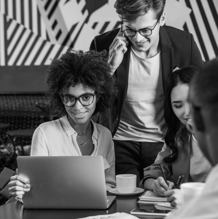 Multiethnic team collaborating on a laptop